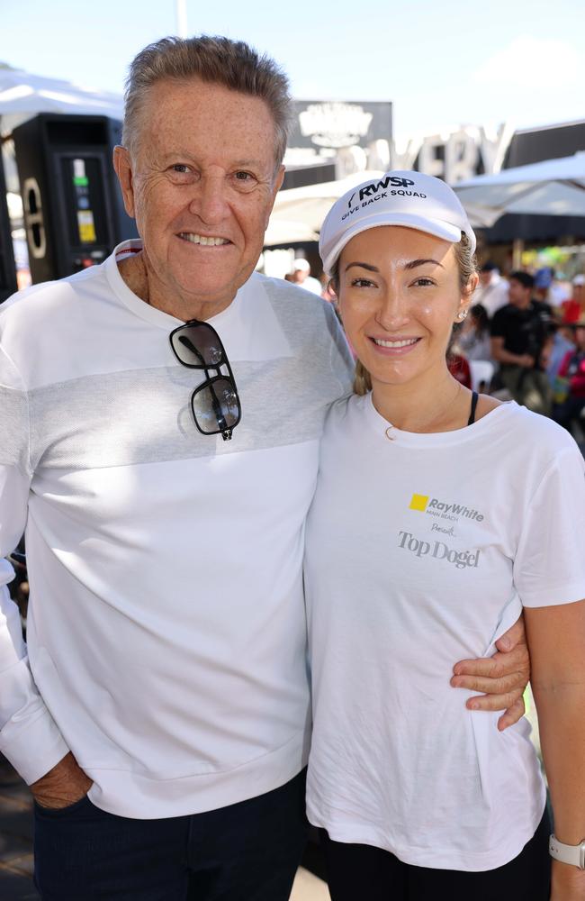 Andrew Bell and Chelsea Gates at the Ray White Surfers Paradise Next Top Dogel competition on Tedder Avenue Main Beach. Picture, Portia Large.