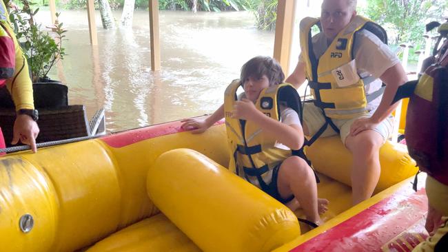 Noah, 12, was shocked and a little nervous by the rapid flooding but happy when emergency services arrived with a rescue boat. Picture: Nicolette Stewart