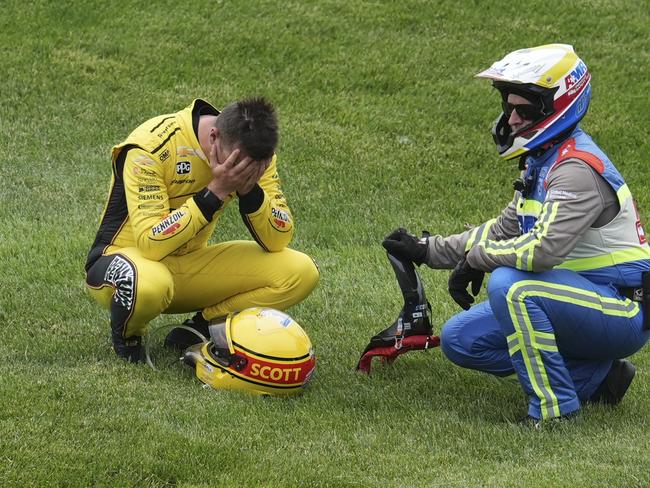 Scott McLaughlin holds his head in his hands after his warm-up lap crash. Picture: AP Photo