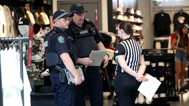 Police at the Foot Locker Rundle Mall store after thieves threaten staff with an axe and stole goods. Picture: Kelly Barnes