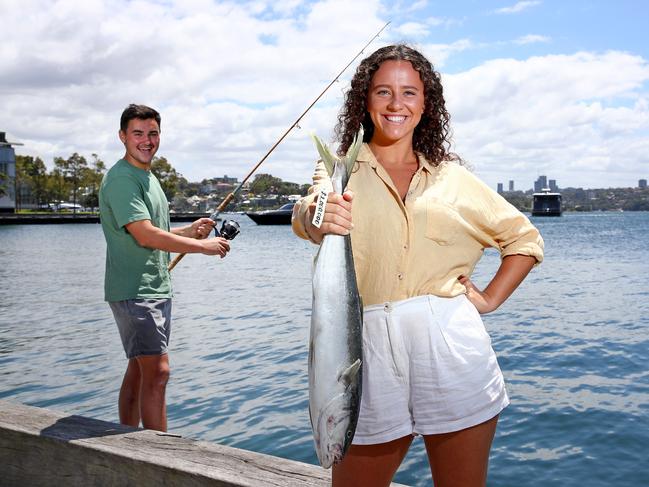 BRADFIELD CAMPAIGN - Ben Buckland and Nicola Muddle hold a Kingfish like the one that will be tagged and released in Sydney Harbour that will pay $1m to whoever catches it as part of a Western Harbour Alliance plan for a Sydney Harbour festival. Picture: Toby Zerna
