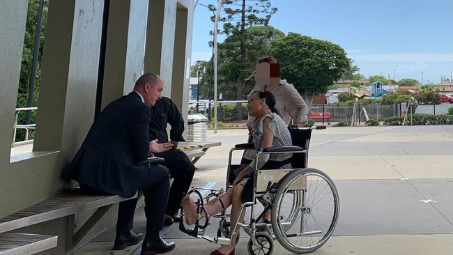 Shelley Louise Brumby appeared in a wheelchair at the Pine Rivers Magistrates Court to face a manslaughter charge. Pictured with lawyer Glen Carpenter.