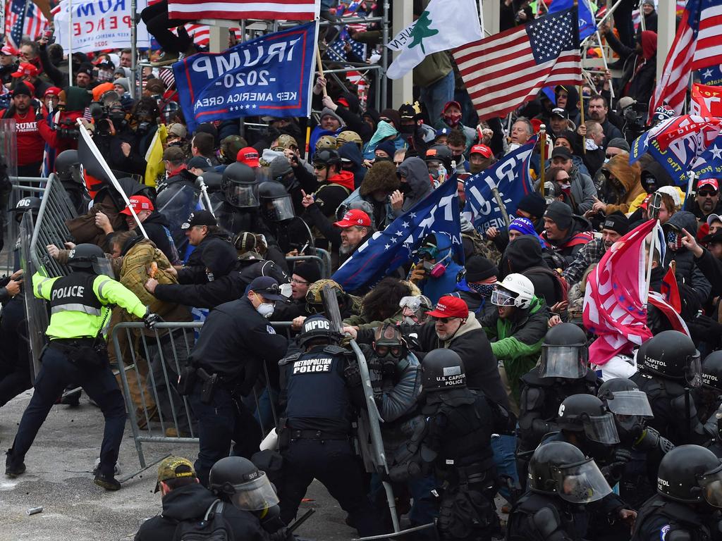 Trump supporters clash with police and security forces as they push barricades to storm the US Capitol in Washington D.C. Picture: Roberto Schmidt/AFP