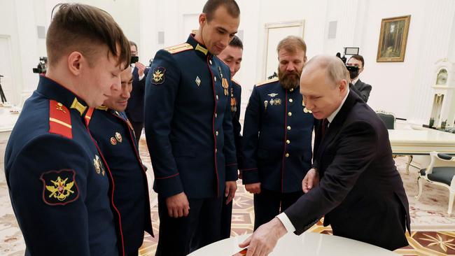 Vladimir Putin attends a meeting with members of the Alyosha T-80 tank crew in Moscow. Picture: AFP.