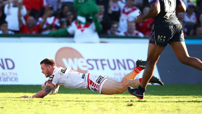 Euan Aitken scores a try for the Dragons.