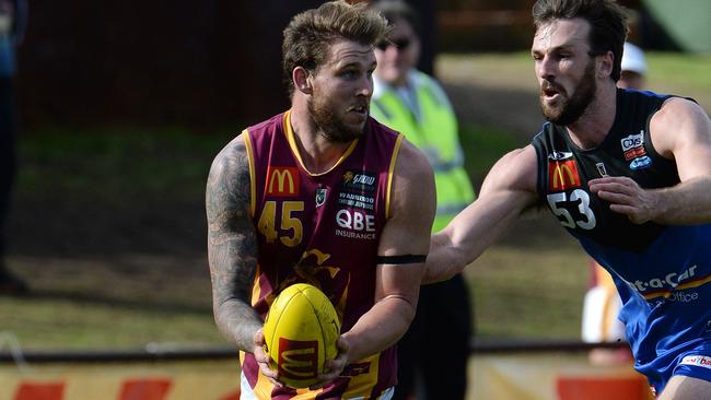 Hamish Shepheard in action against former West Coast defender Eric Mackenzie.