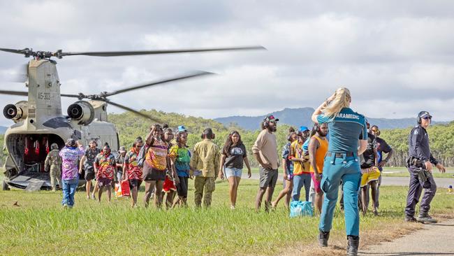 Australian Army personnel from the 5th Aviation Regiment, Queensland Police and emergency services assist residents to evacuate from Wujal Wujal to Cooktown via CH-47F Chinook helicopter.