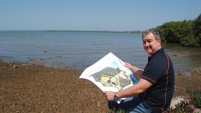 Moreton Bay Regional Councillor Peter Flannery (Div 2) with the plan for the DPI building at Deception Bay.