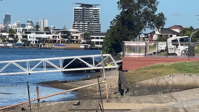 A stolen Hyundai van is pulled from the Nerang River beside TSS on Thursday. Picture: Charlton Hart.