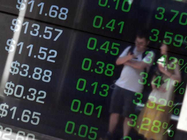 Pedestrians are seen reflected on the Australian Stock Exchange (ASX) trading board in Sydney, Friday, January 3, 2020. (AAP Image/Mick Tsikas) NO ARCHIVING