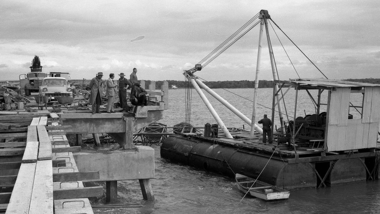 News /property 8/8/1963. Investigators start probing the cause of an industrial accident during construction of the Bribie Island bridge, north of Brisbane. A crane's mechanism failed as a bearer was being lifted into place on the Bribie end of the bridge, allowing the 22m pre-stressed concrete bearer to crash into the water. Neg/no S30395 box/no Picture by Ray Saunders Scanned June 2010 The Courier-Mail Photo Archive.