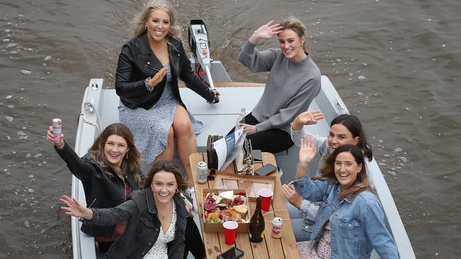 A group of women ride a Goboat on the Yarra River on Saturday. Picture: David Crosling