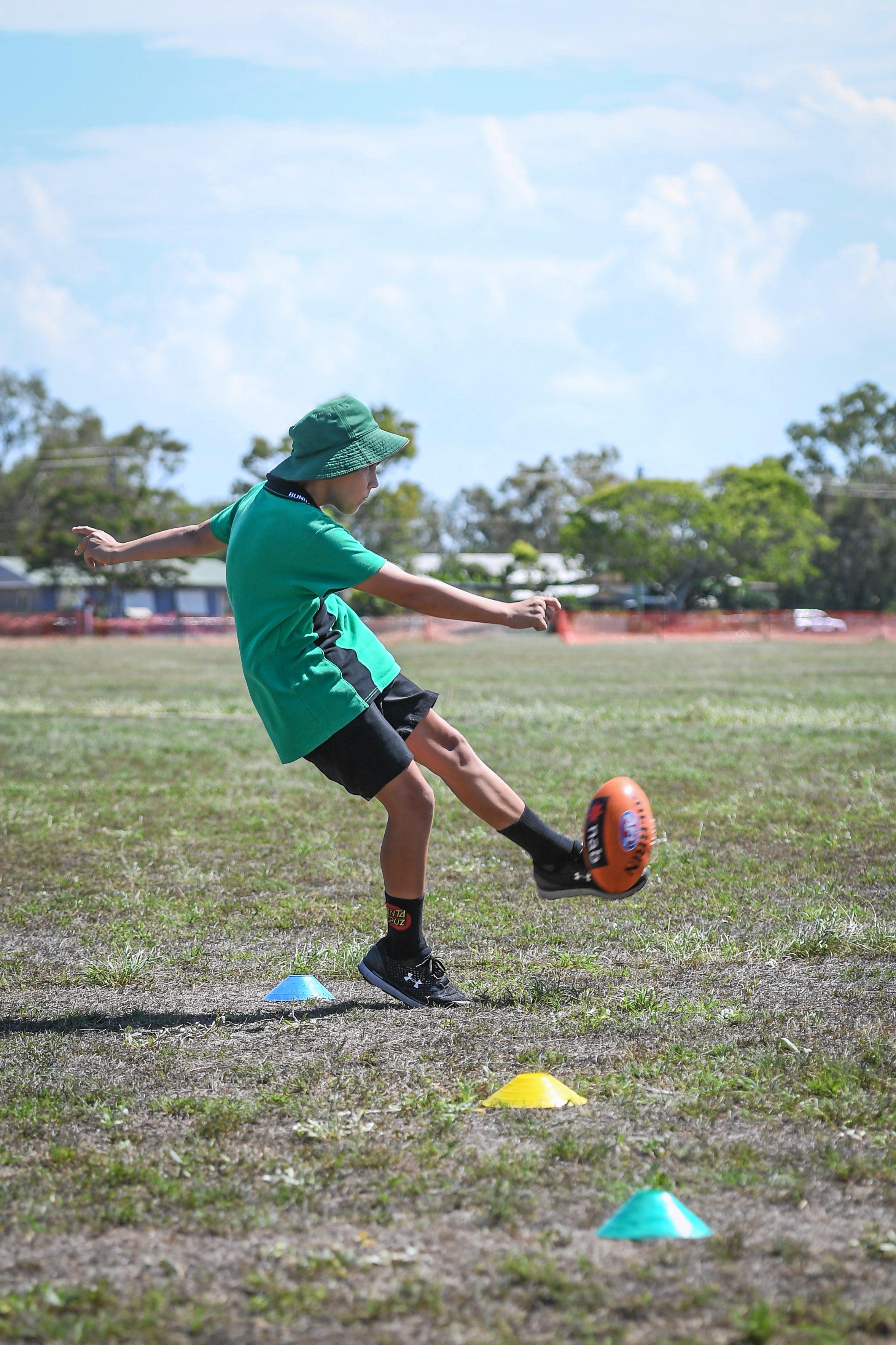 Jie Santos kicks the ball into play. Picture: Brian Cassidy