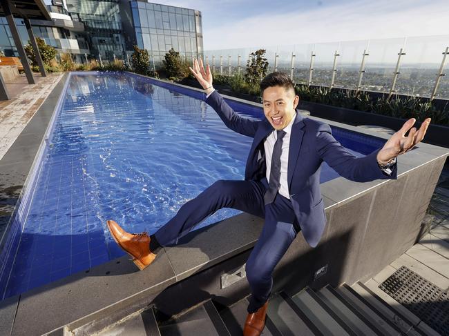 Calvin Chan is one of the top real estate agents under 35 in Victoria, in 'The Chen' building in central Box Hill, with Box Hill, which has rapidly developed, behind. Picture: Alex Coppel.