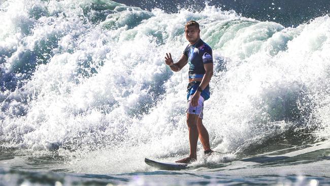 Mick Fanning waves at the crowd at the Quiksilver Pro on the Gold Coast. Picture: Nigel Hallett