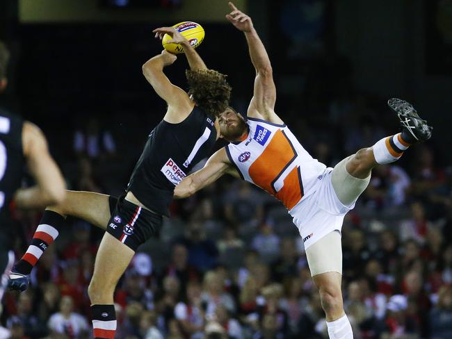 Tom Hickey and Shane Mumford contest a centre bounce. Picture: Colleen Petch