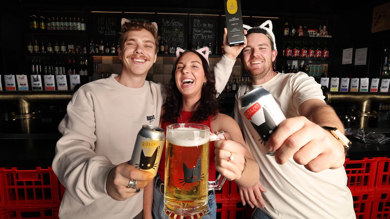 Angus Lee, Olivia Lee and Connor Lee at Miami brewery RojiCat with their award-winning Chilli Cat beer. Picture: Annette Dew.
