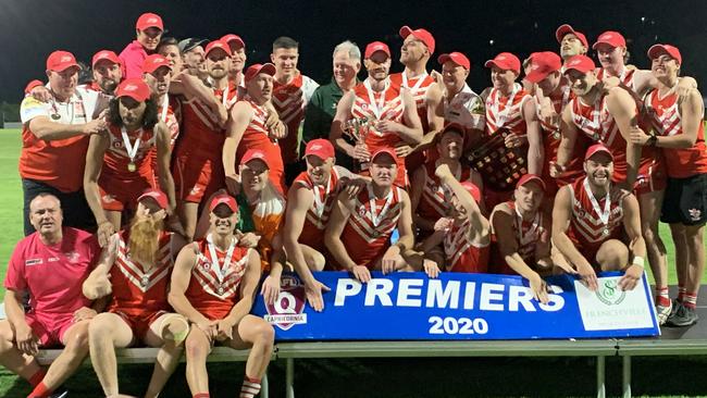 The Yeppoon Swans celebrate after winning their sixth AFL Capricornia flag and claiming the record for the most consecutive wins in Aussie rules history. Photo: Jann Houley