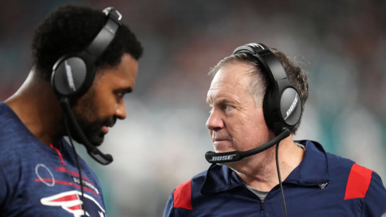 MIAMI GARDENS, FLORIDA - JANUARY 09: Head coach Bill Belichick of the New England Patriots and inside linebackers coach Jerod Mayo talk on the sidelines in the fourth quarter of the game against the Miami Dolphins at Hard Rock Stadium on January 09, 2022 in Miami Gardens, Florida. (Photo by Mark Brown/Getty Images)