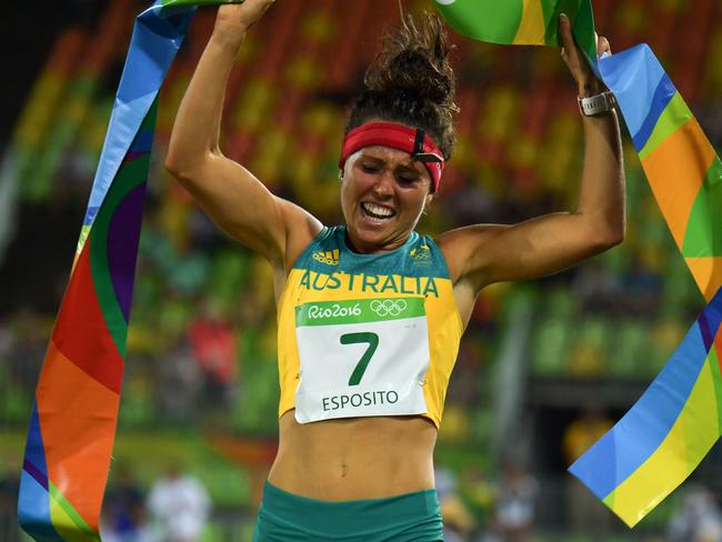 Australia's Chloe Esposito crosses the line to win the combined running/shooting portion of the women's modern pentathlon.