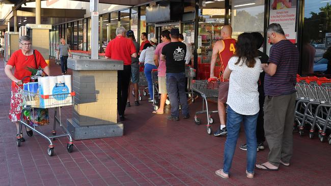 Shoppers line up outside Kurralta Park Coles during the dedicated hour for the elderly and disabled. Picture: AAP / Mark Brake