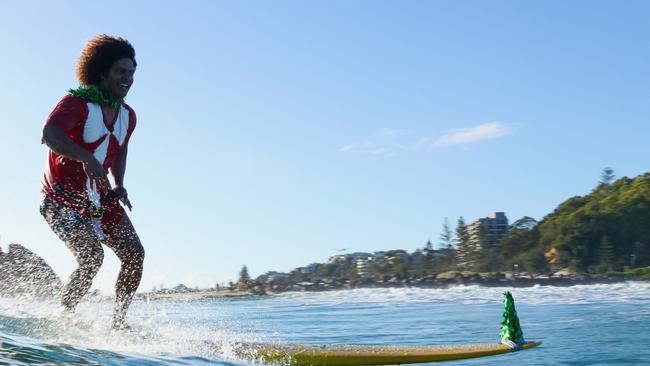 Santas surf at Currumbin Alley. Photo: Luke Workman/@photo_13_ /Instagram