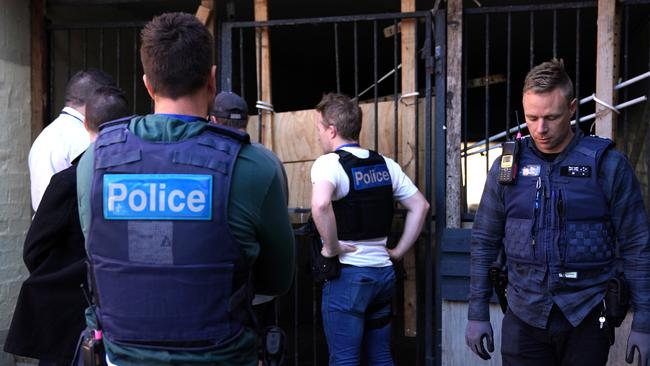 Police get ready to move into the building. Picture: Sean Garnsworthy/AAP