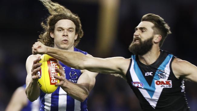 Ben Brown of the Kangaroos marks the ball against Justin Westhoff of the Power. Picture: AAP Image/Daniel Pockett