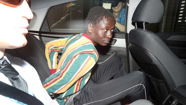 A man arrives at the Brisbane Watchhouse in relation to the murder of Girum Mekonnen at Zillmere. Picture: Tara Croser.