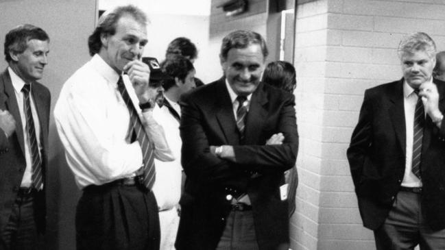 Leigh Whicker, Graham Cornes, Bob Hammond and Bill Sanders in the Crows locker room after the club’s first AFL win in March 1991.