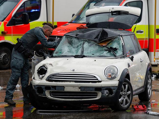 A police officer works at the scene where a car drove into a crowd in the southern German city of Munich. Picture: AFP