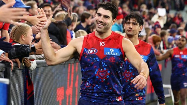 MELBOURNE, AUSTRALIA - MAY 26: Christian Petracca of the Demons high fives fans after winning the round 11 AFL match between Narrm (the Melbourne Demons) v Euro-Yroke (the St Kilda Saints) at Melbourne Cricket Ground, on May 26, 2024, in Melbourne, Australia. (Photo by Quinn Rooney/Getty Images)