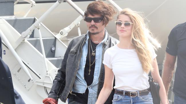 Depp and Heard pictured in Brisbane. The Sun’s lawyer alleges that texts between Depp and an assistant reveal that he tried to get drugs while in Australia. Picture: News Corp