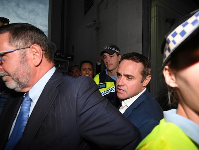 McCormack makes his way through a media scrum as he leaves the police station. Picture: AAP/Dan Himbrechts