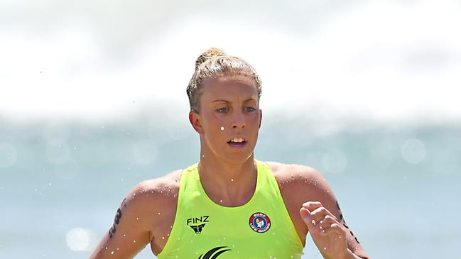 Georgia Miller exits the water in the lead in the lead in the Coolangatta Gold title. Photo: Harvpix