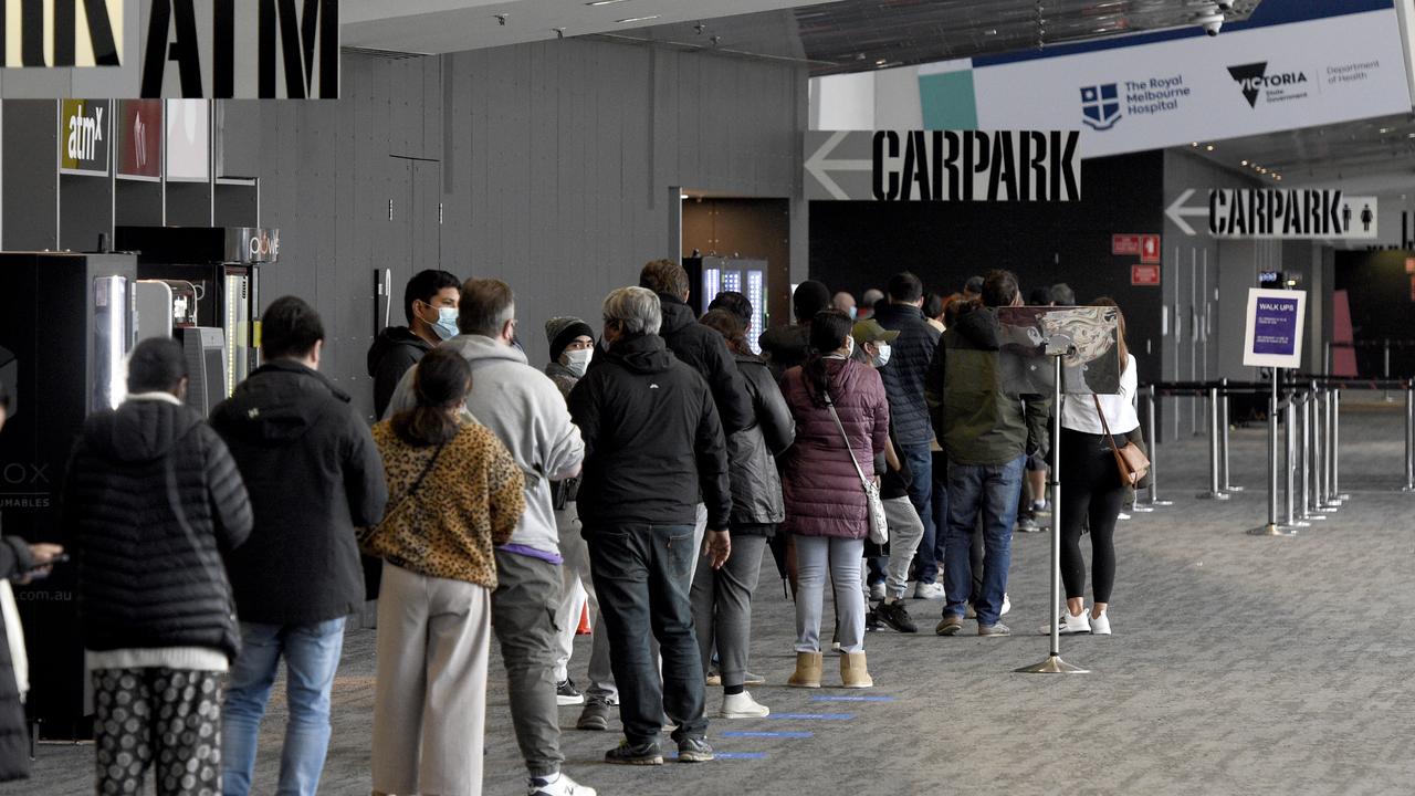 People queue at the Covid-19 vaccination centre at the Melbourne Exhibition Centre at Southbank on Friday. Picture: Andrew Henshaw / NCA NewsWire