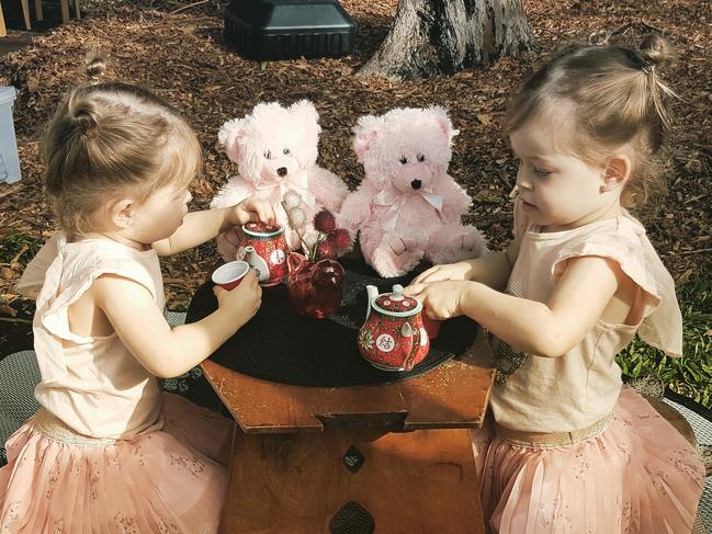 Twins Rhainer and Skylar Lawrence enjoying a tea party. Pic: Supplied