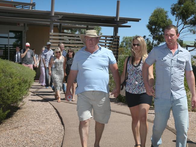 Keith Woodford (centre)) and other family members leave court after Davey pleaded guilty to murdering his wife Gayle in the APY Lands. Picture: Dean Martin