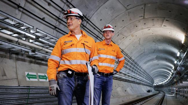 Cross River Rail CEO Graeme Newton and Transport Minister Mark Bailey inspect works under way deep inside the tunnels on Sunday morning. Picture Lachie Millard