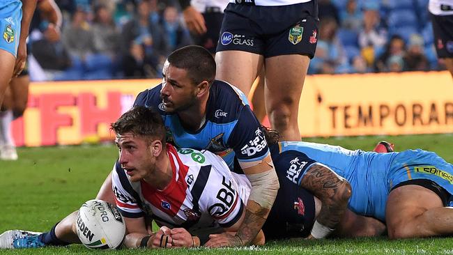 Paul Momirovski scores a try on debut for the Roosters.