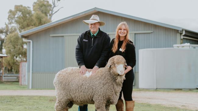 Stephen Chalmers from Nutrien purchased the top priced ram for $5250 on behalf of a client in NSW. He stands with Claire McGauchie of Terrick West Poll Merino stud at Prairie.