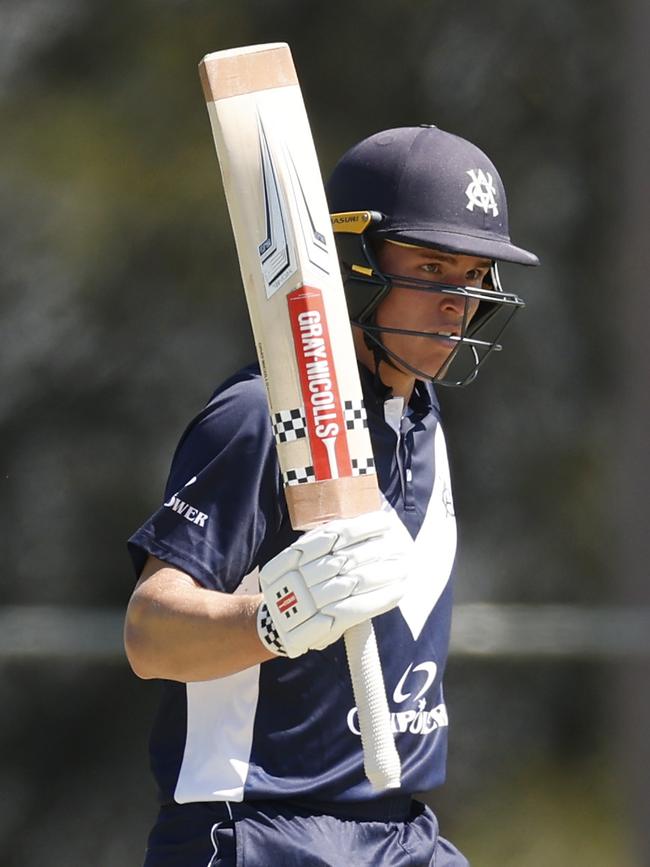 Harry Dixon of Victoria raises his bat after scoring 50 runs during the ODC match between New South Wales and Victoria. Picture: Darrian Traynor/Getty Images.