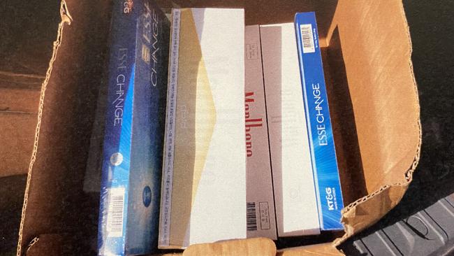 Cartons of illegal tobacco found in the home and car of Xi Wang. Picture: District Court.