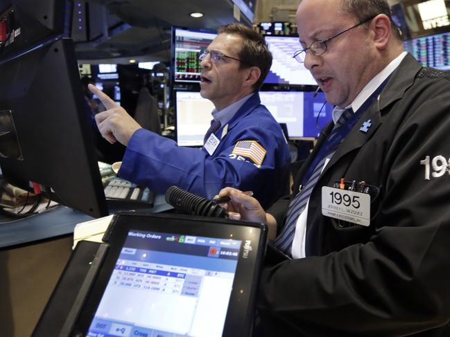 Specialist Charles Solomon, left, and trader Jeffrey Vazquez work on the floor of the New York Stock Exchange at the closing bell, Tuesday, June 2, 2015. U.S. stocks closed slightly lower as a slump in utilities offsets a gain in energy stocks. (AP Photo/Richard Drew)