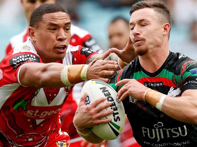 SYDNEY, AUSTRALIA - MAY 13:  Damien Cook of the Rabbitohs is tackled during the round 10 NRL match between the South Sydney Rabbitohs and the St George Illawarra Dragons at ANZ Stadium on May 13, 2018 in Sydney, Australia.  (Photo by Jason McCawley/Getty Images)