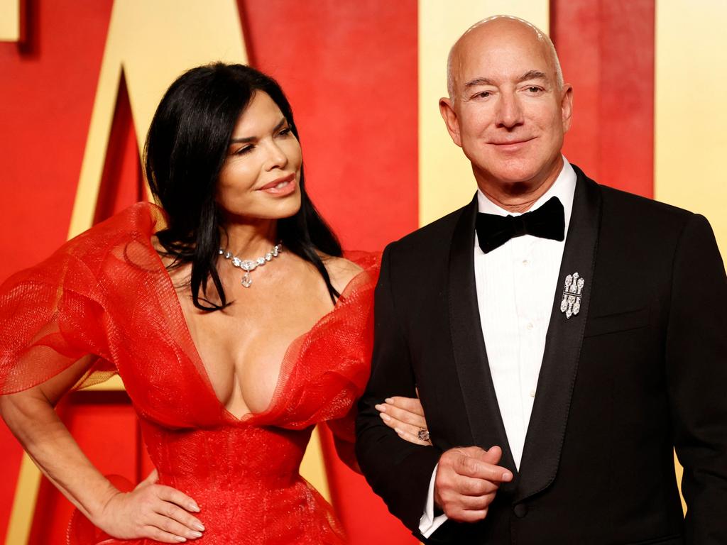 Amazon (founder Jeff Bezos and partner Lauren Sanchez pictured) has ordered all of its corporate staff back to the office. Picture: Michael Tran/AFP