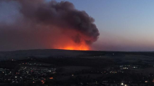 A photo of the Pechey bushfire at dusk on November 13, looking back from Crows Nest. PHOTO CREDIT: Matthew Eastgate Photography and Film