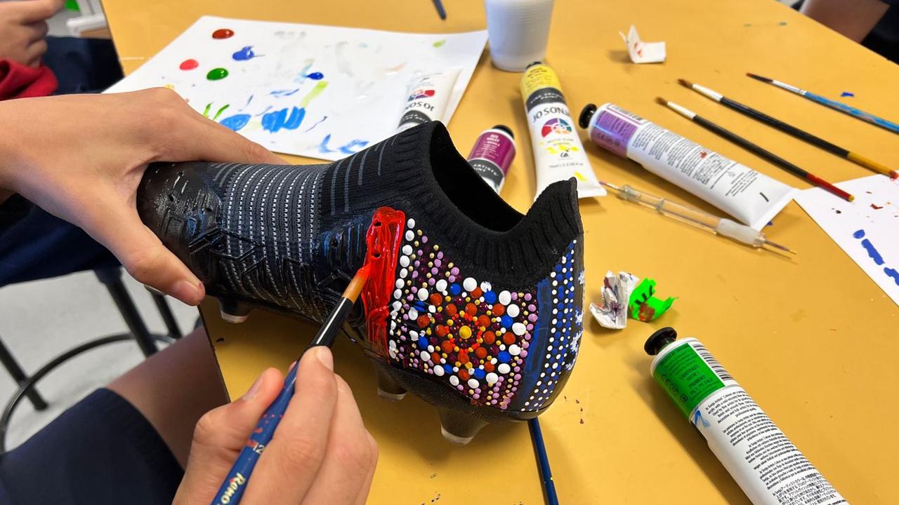 Indigenous youth have painted boots for several NRL players and referees to wear during Indigenous round.