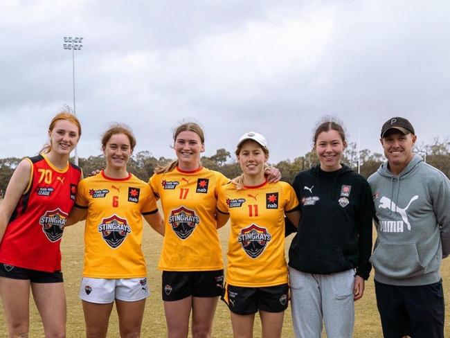 Vic Country squad members Mackenzie Eardley, Amber Clarke, Bianca Lyne, Emily Shepherd and Brooke Smith with Tarkyn Lockyer. Picture: Jasmine Bennett