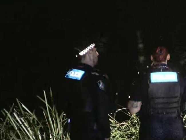 Police on scene at the Brisbane River after a man fell in and failed to resurface on Sunday.